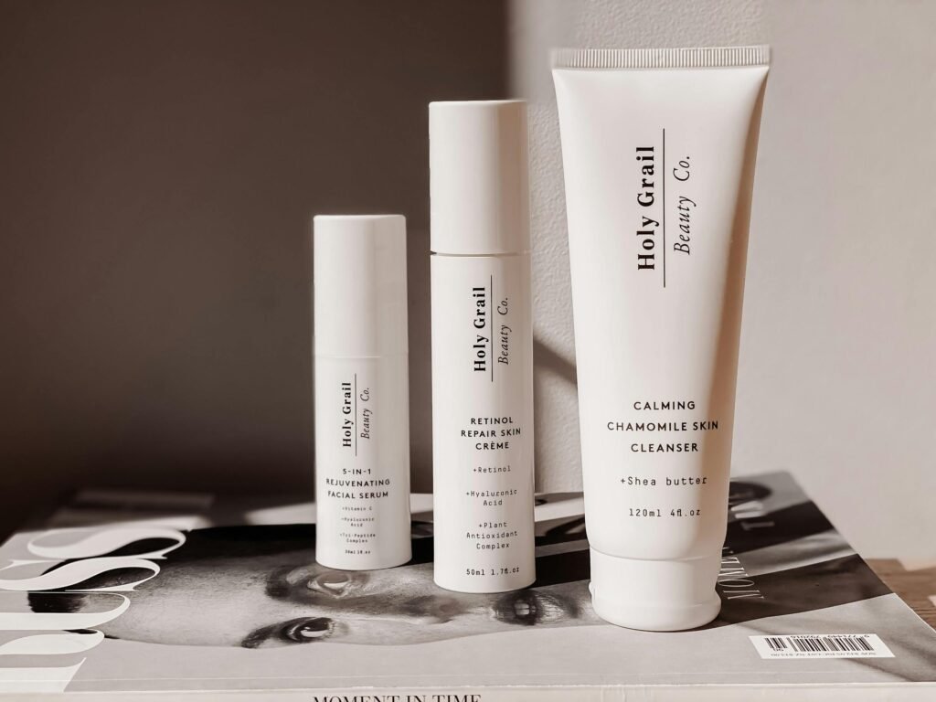 Elegant display of skincare products atop a fashion magazine, ideal for beauty marketing.